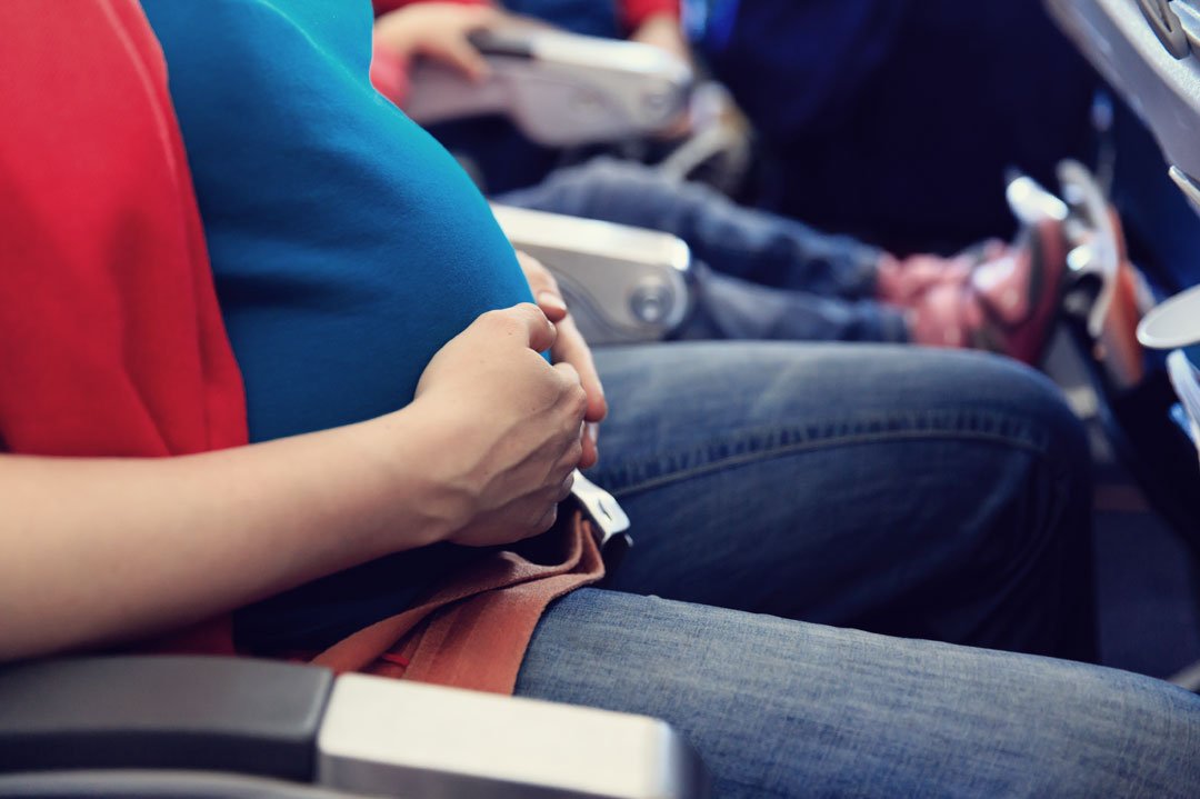 pregnant woman in airplane