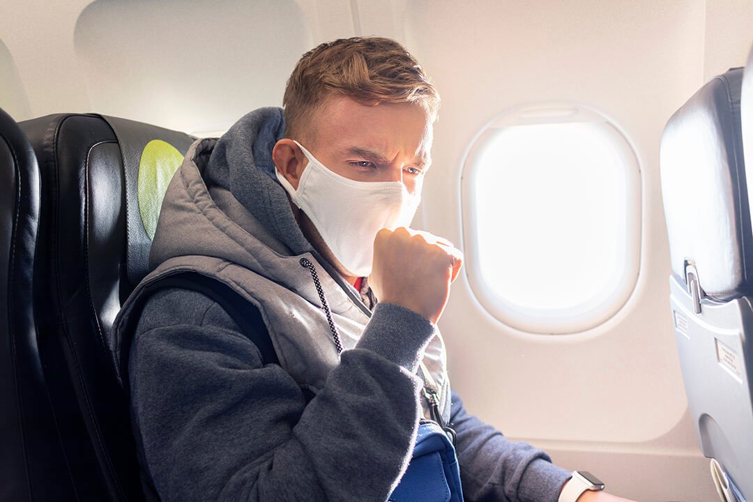 sick person on a plane