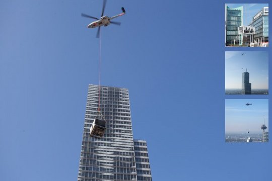 Schwerlasthubschrauber Super Puma bringt neue Klimaanlage auf den Kölnturm